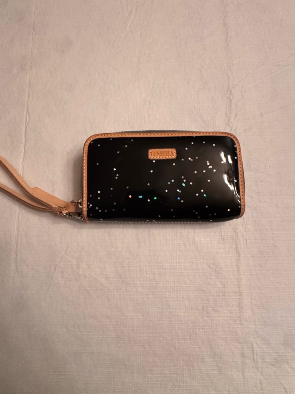 Consuela Black Holographic Star Wristlet with Tan Trim
